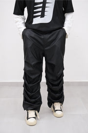 Pantalone ecopelle drappeggiato