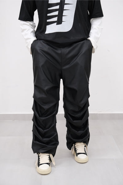 Pantalone ecopelle drappeggiato